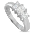 14K white gold three-stone diamond ring with emerald-cut center and side stones
