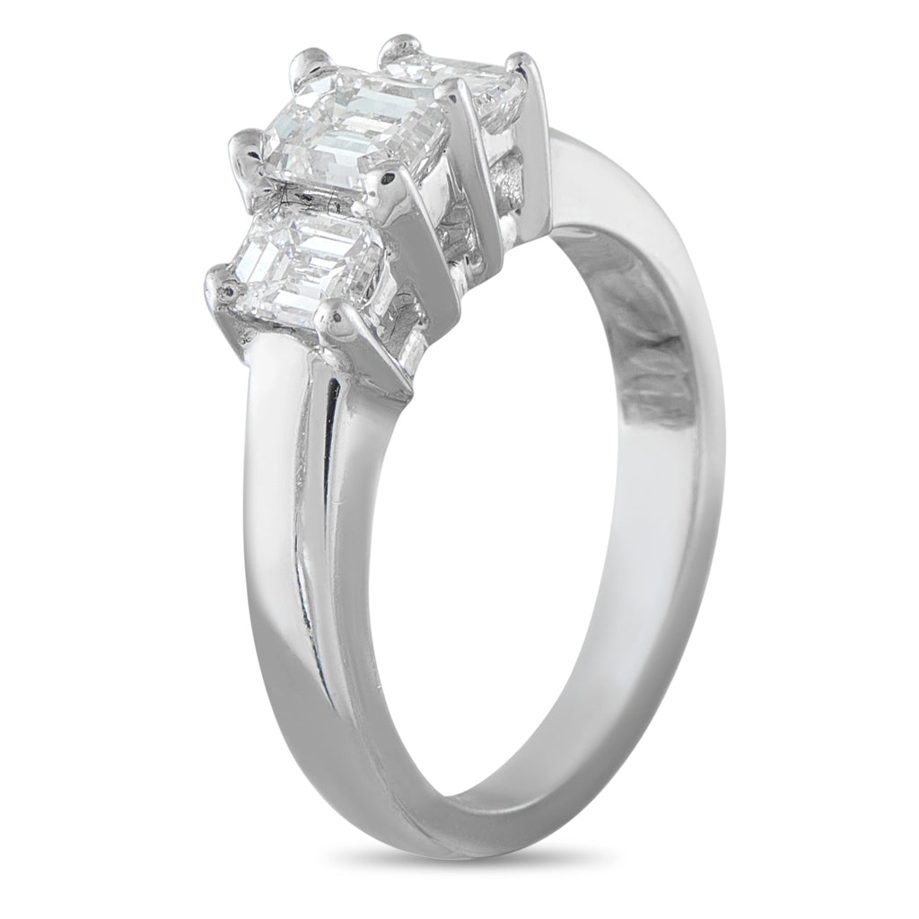 14K white gold three-stone diamond ring with emerald-cut stones in a raised setting