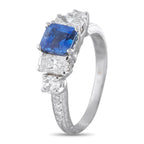 White gold ring with square blue sapphire and three diamond accents