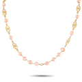 14K yellow gold necklace with pale pink coral beads and ornate openwork links