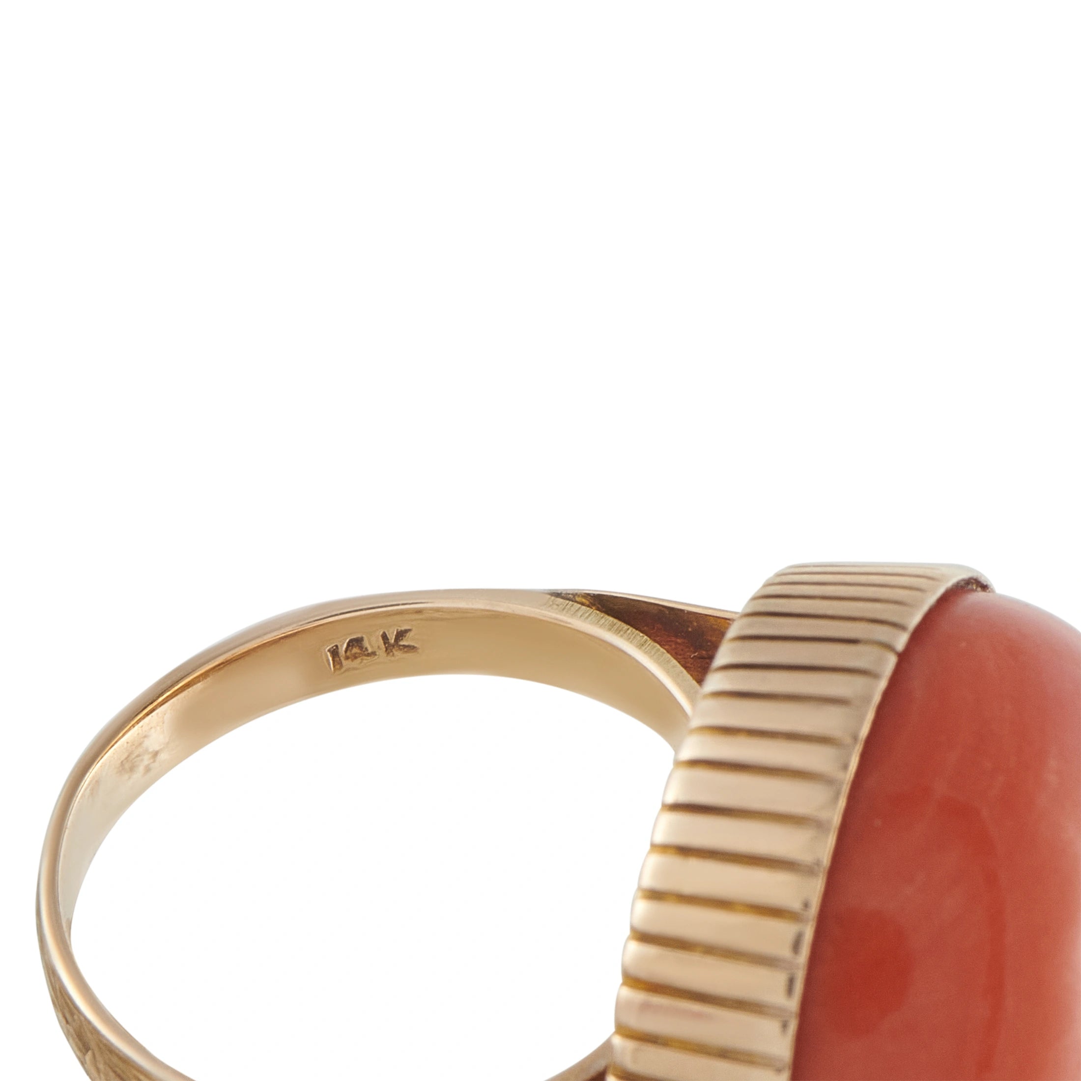14K marked inside 14K yellow gold ring with coral red domed top and ribbed bezel