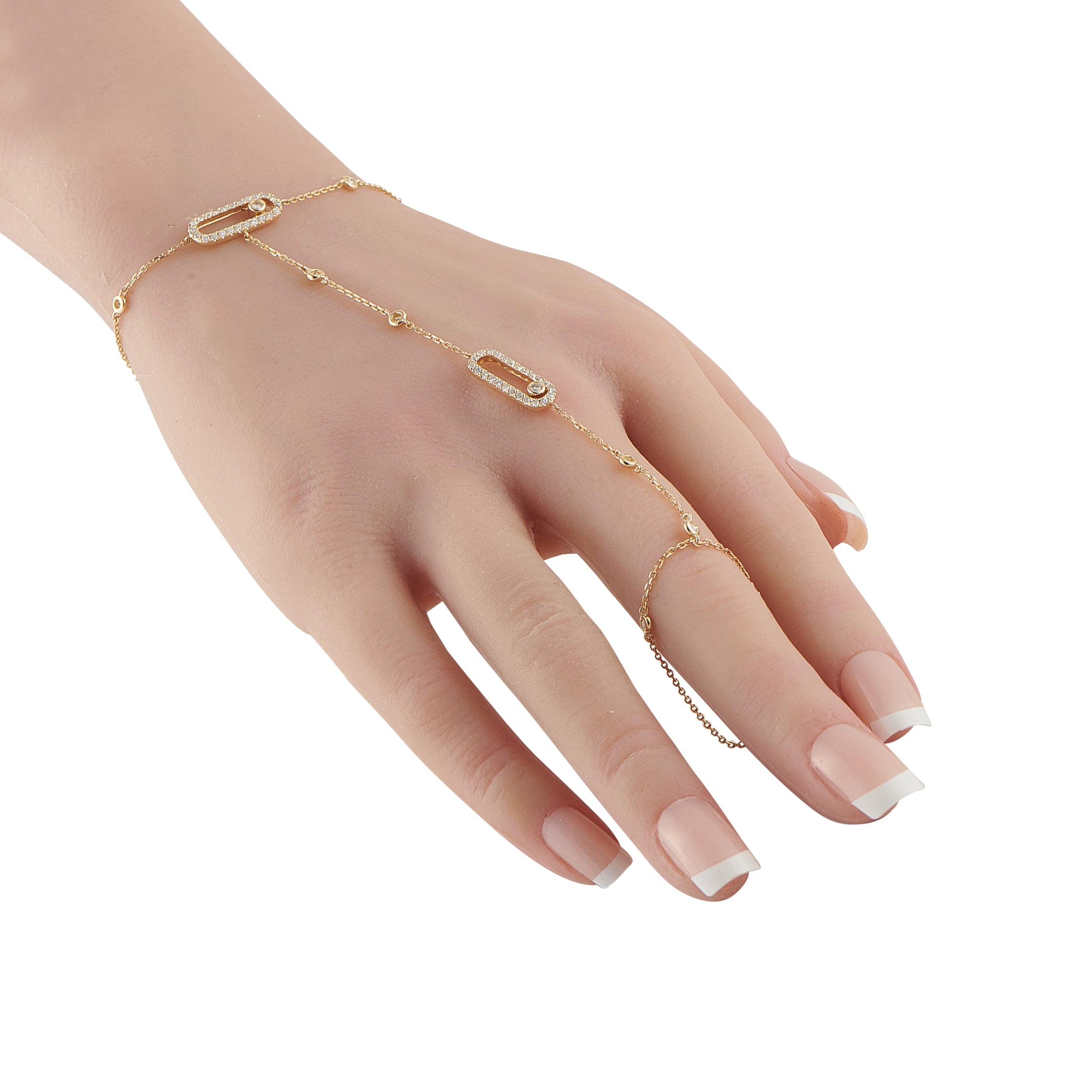 Exclusive 14K Yellow Gold 0.80ct Diamond Hand Chain Bracelet This hand chain bracelet is filled with dynamic details. Subtle yet statement making, the 14K Yellow Gold chain wraps around 