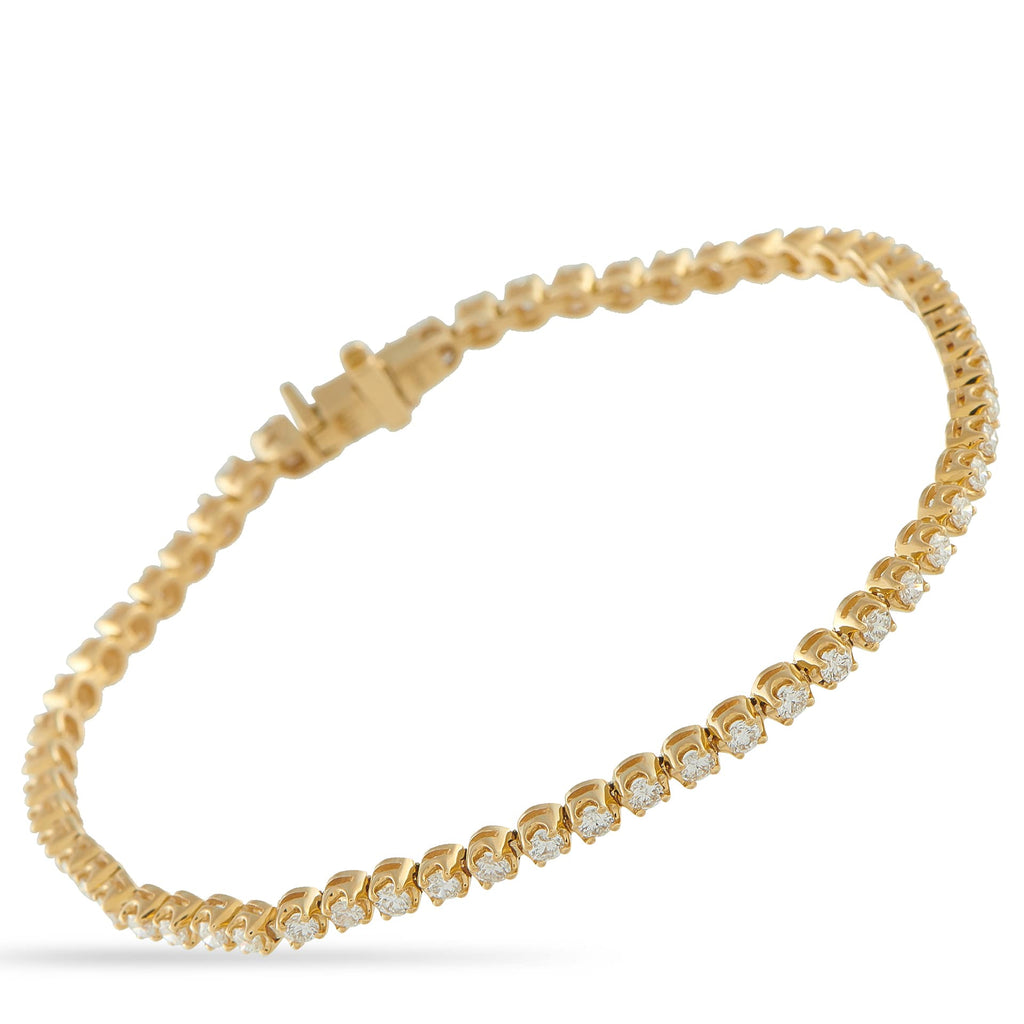 Exclusive 14K Yellow Gold 1.82ct Diamond Tennis Bracelet The classic design and warm gold tone of this Exclusive  bracelet make it effortlessly versatile. It features 1.82 carats of 