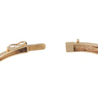 Yellow gold diamond bracelet clasp close-up with hinge setting