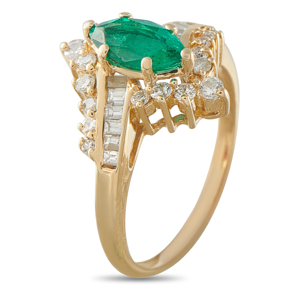 14K yellow gold ring with oval emerald center, baguette-style and round diamonds