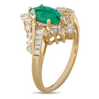 14K yellow gold ring with oval emerald center, baguette-style and round diamonds
