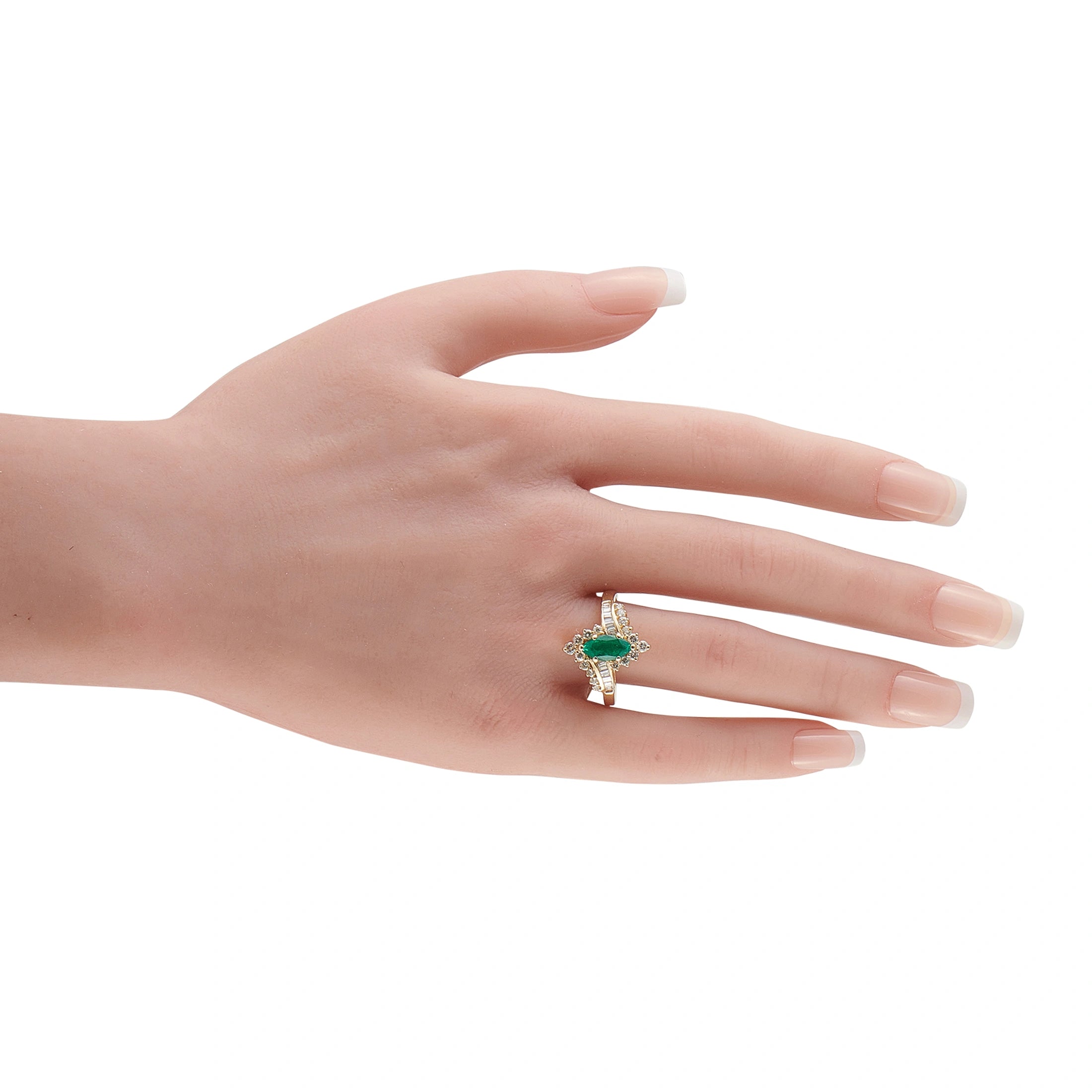 14K yellow gold emerald and diamond ring on hand, visible oval emerald center