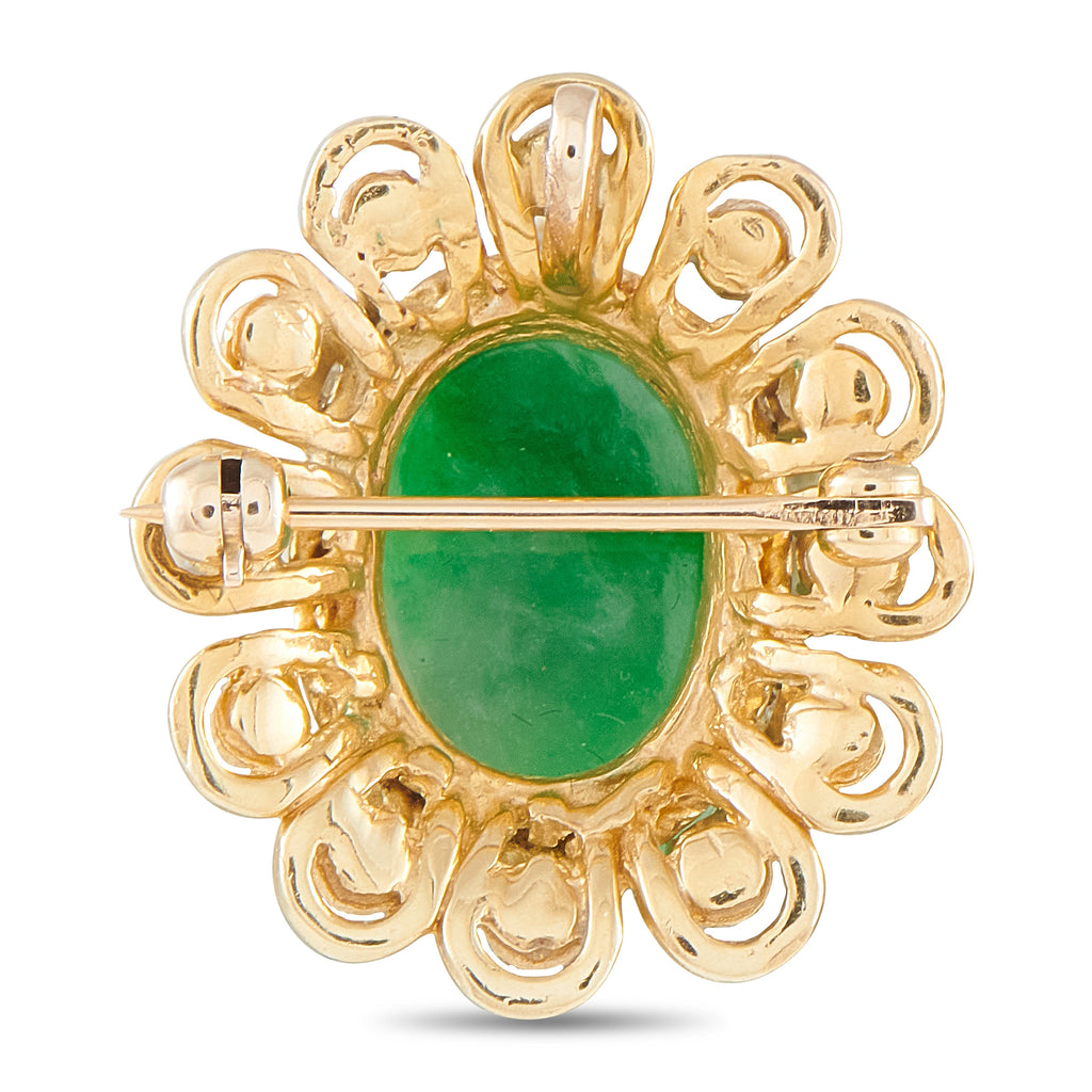 Green jade cabochon pendant with yellow gold scroll frame and diamond accents