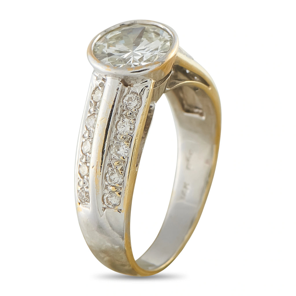 Yellow gold diamond ring with round center stone and channel-set side diamonds