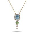 Yellow gold pendant with blue cushion sapphire, diamond halo, green center and drop accents