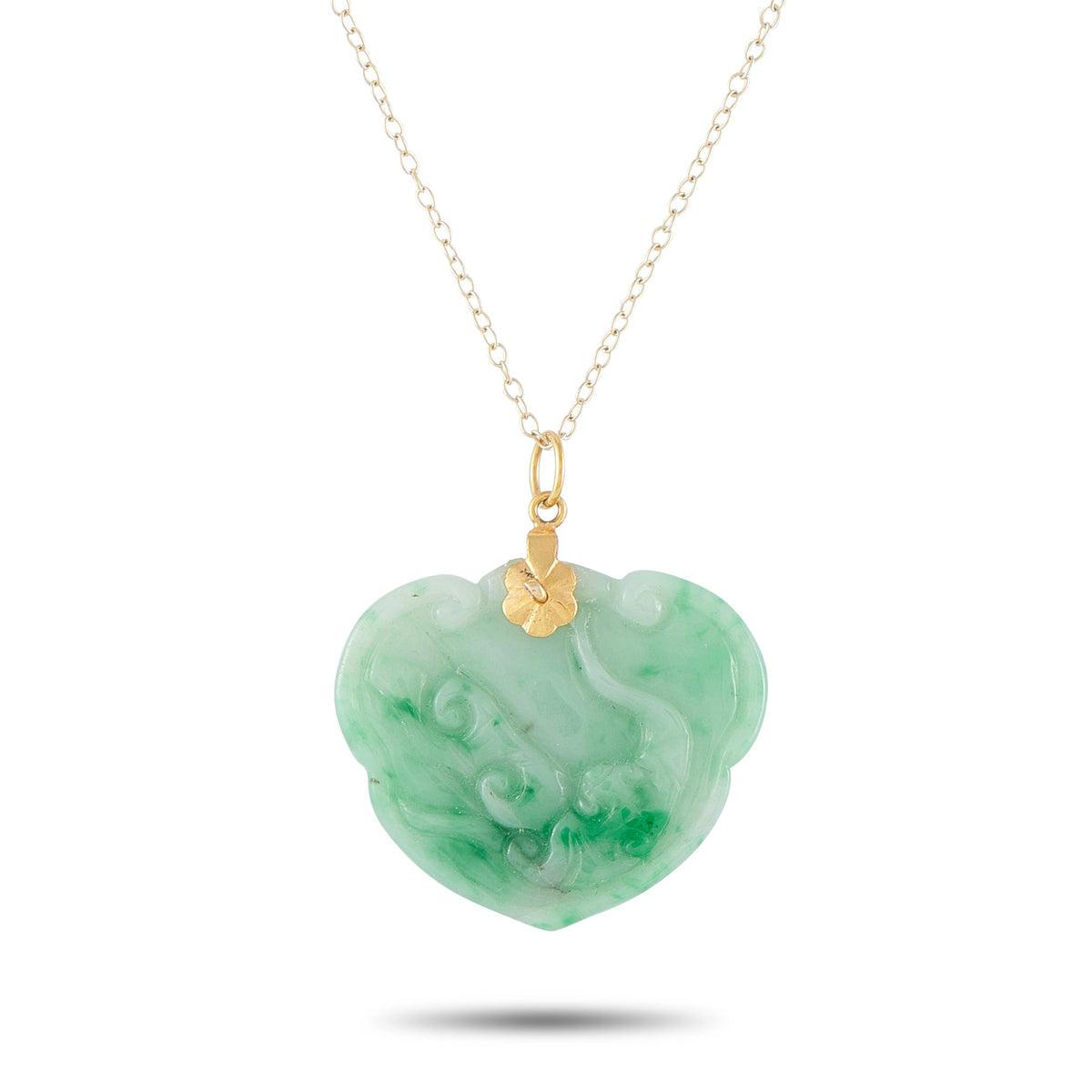 Heart-shaped carved green jade pendant on 14K yellow gold chain