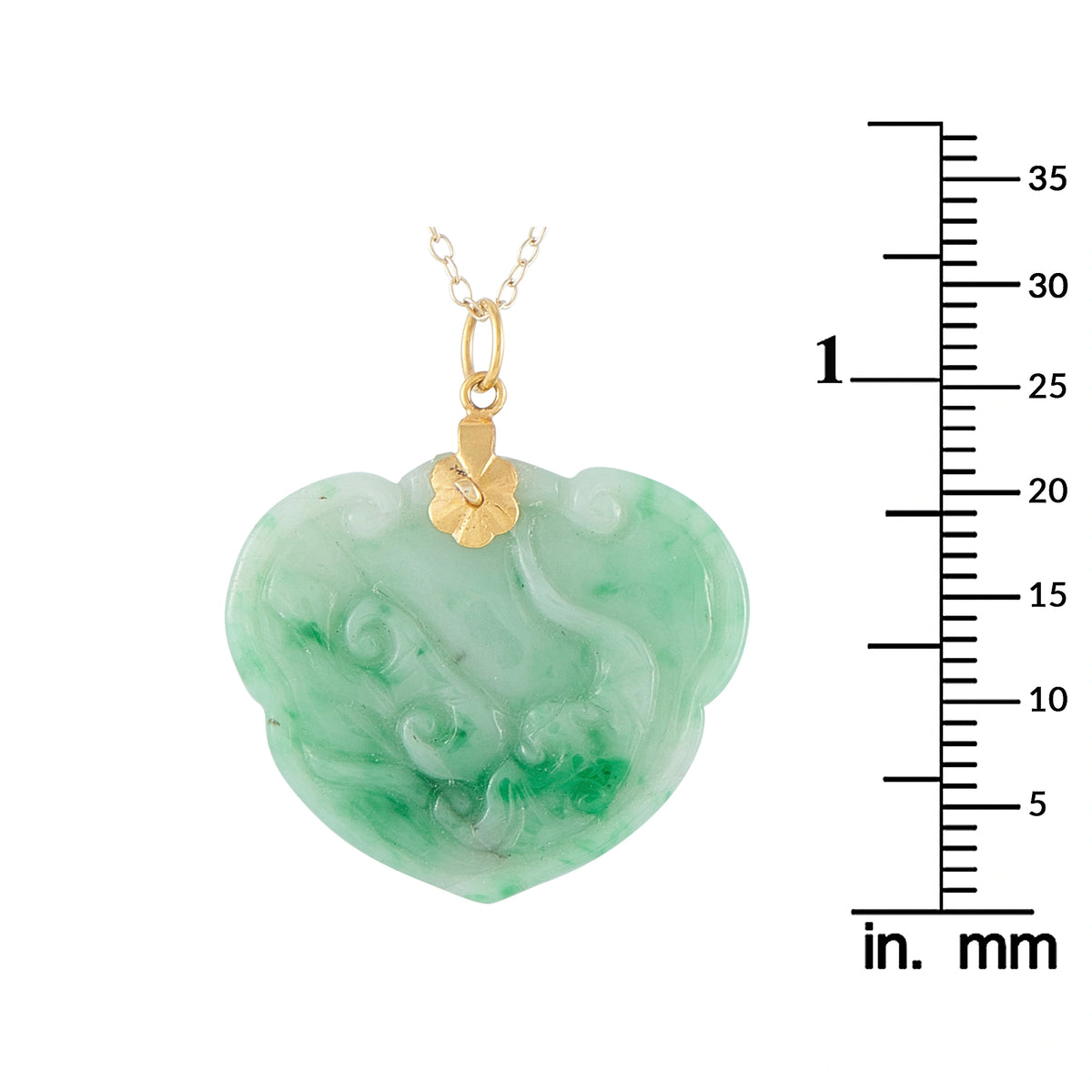 Heart-shaped green jade pendant with 14K gold bail, shown with size ruler