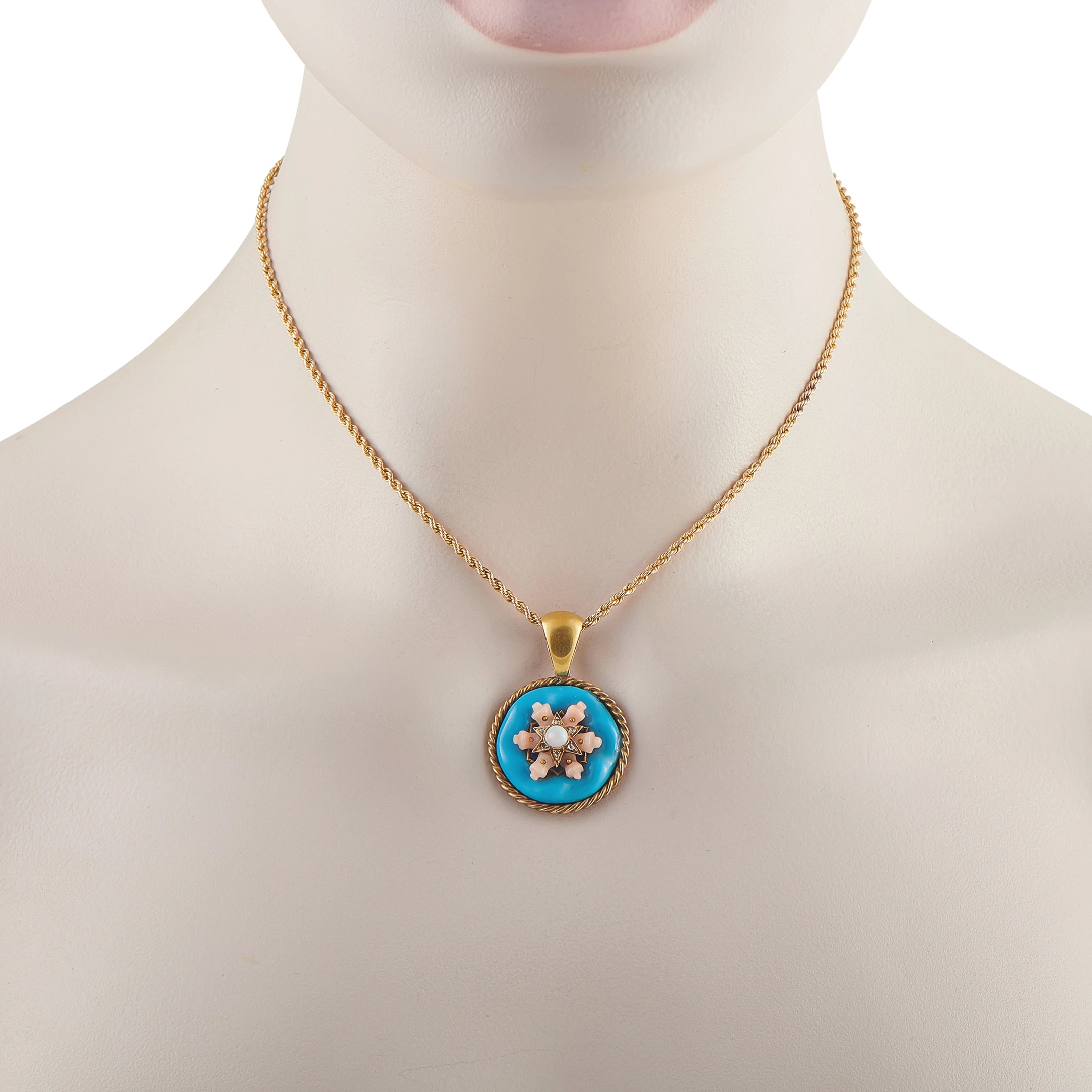 Gold tone necklace with round blue enamel pendant and coral-like floral accents