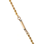 Gold tone chain necklace with oval bail and connector link detail