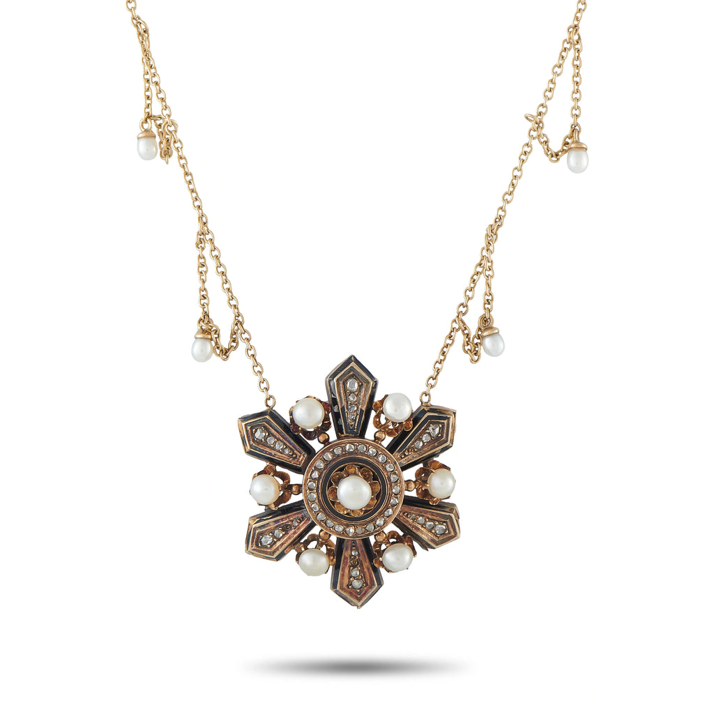 Gold tone necklace with ornate cross pendant, pearl drops, and dark inlays