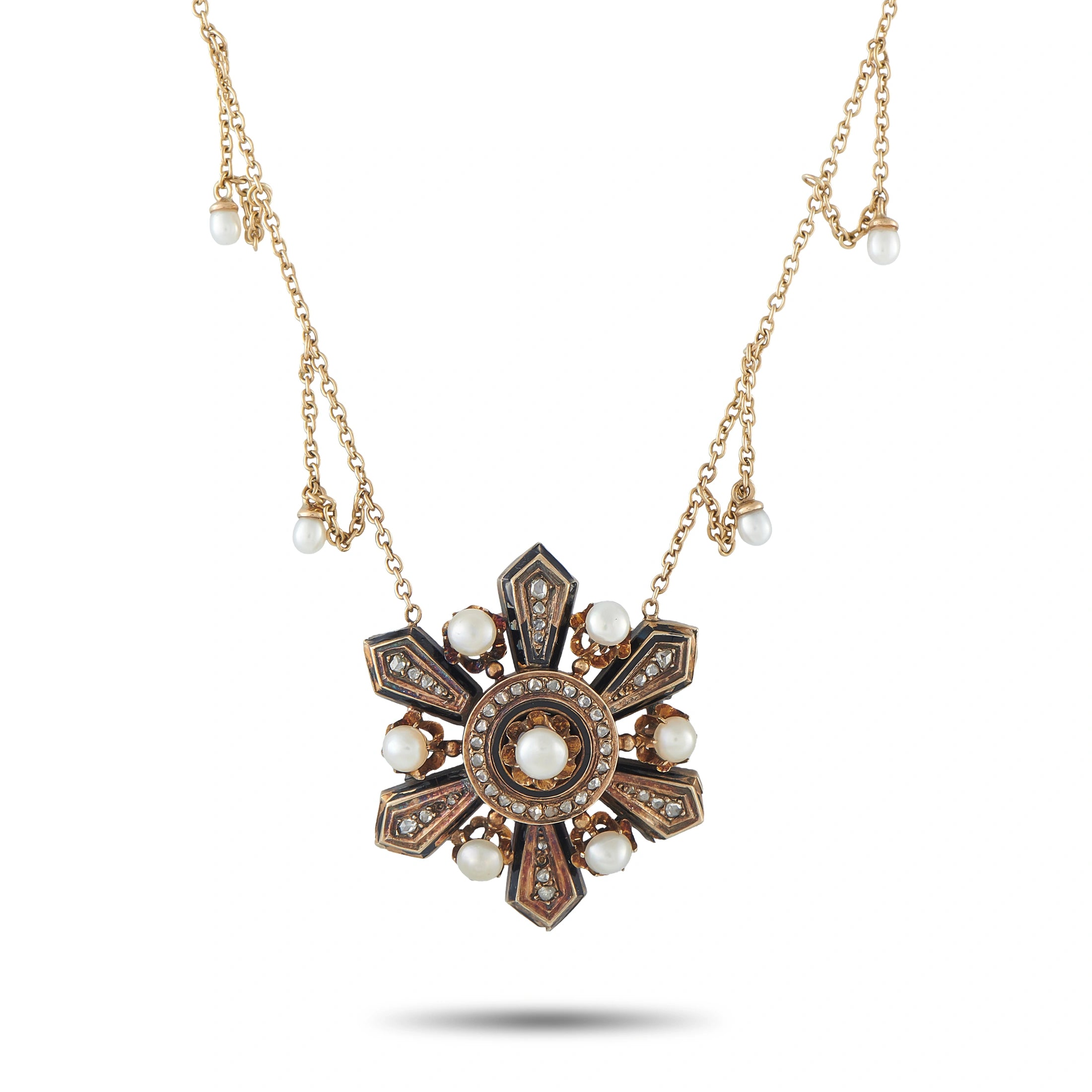 Gold tone necklace with ornate cross pendant, pearl drops, and dark inlays