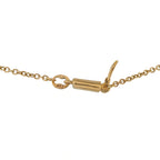 Gold clasp and chain of ornate cross necklace with small pearl details