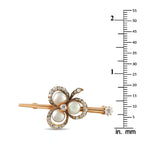 Rose gold flower brooch with three white pearls, diamond halo, and in. mm scale