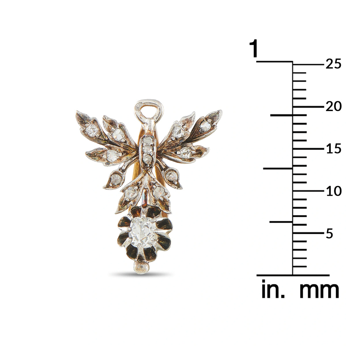 Diamond French pendant with leaf motif, shown beside mm ruler for size