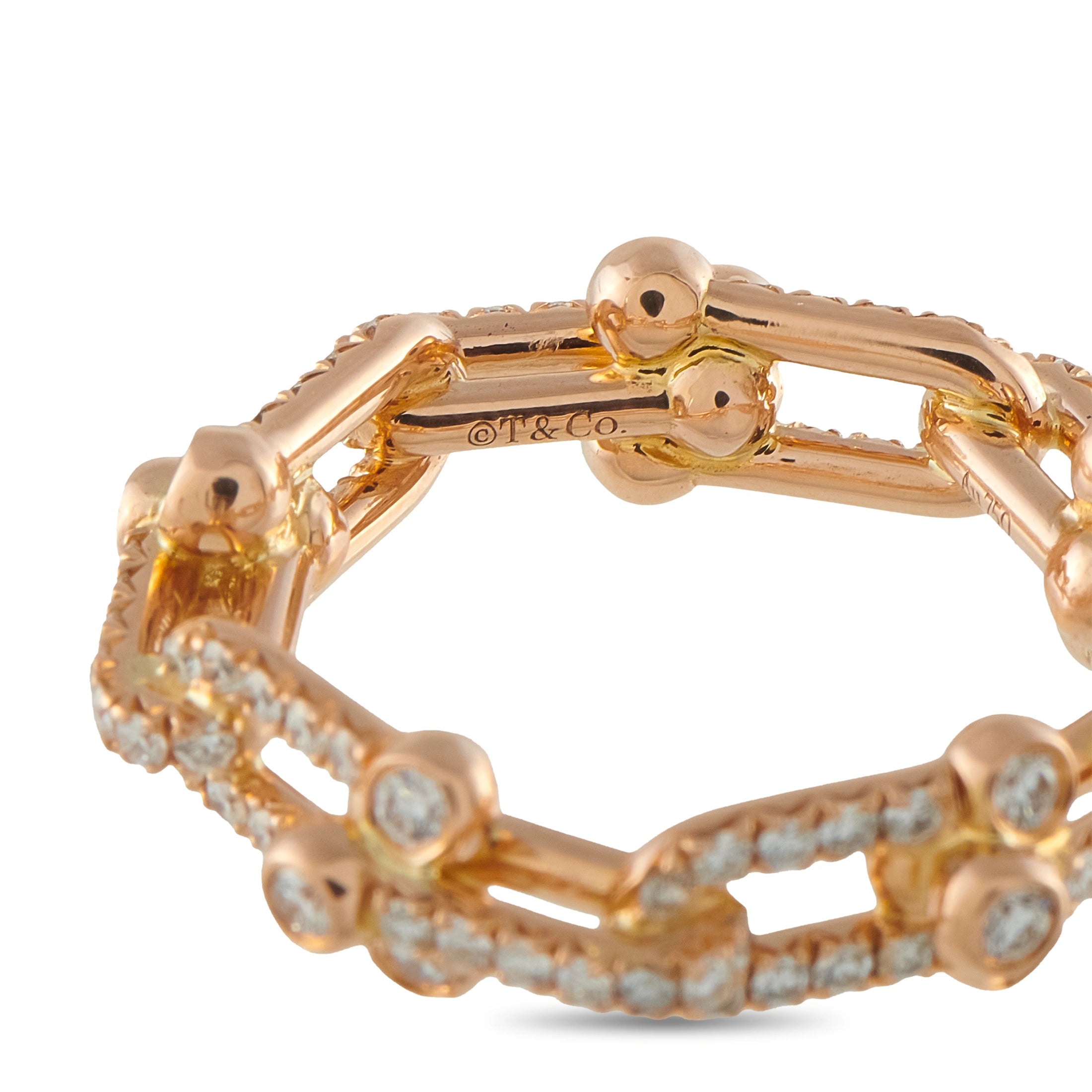 Rose gold diamond band close-up of inner rail marked 'T&Co' with pave stones