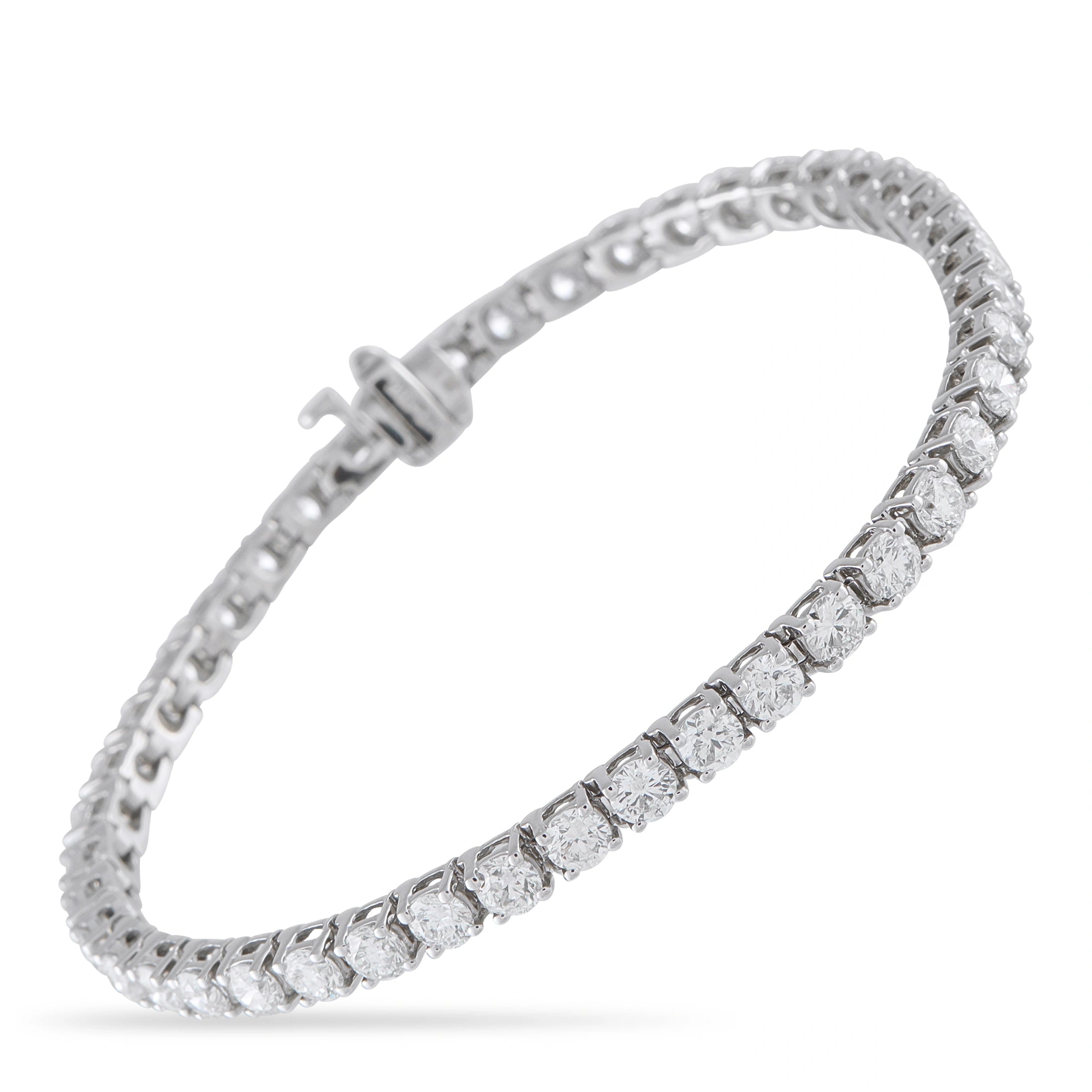 White gold diamond tennis bracelet with oval-cut stones and box clasp, hinged design