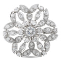 White gold diamond cluster flower brooch with round center stone and marquise accents