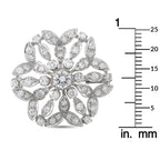 White gold diamond cluster flower brooch shown with mm size ruler for scale
