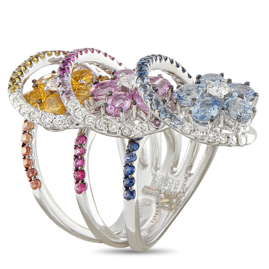 18k white gold three-stone style ring with pink, yellow, blue sapphires and diamond halo