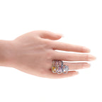 18k white gold multicolored sapphire and diamond ring on open hand