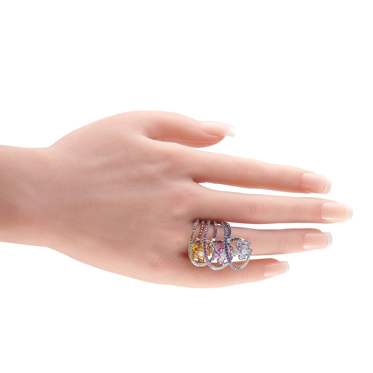 18k white gold multicolored sapphire and diamond ring on open hand