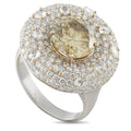 White gold diamond halo ring with round center stone, pavé setting