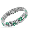 Silver tennis bracelet with green emerald accents and sparkling clear stones