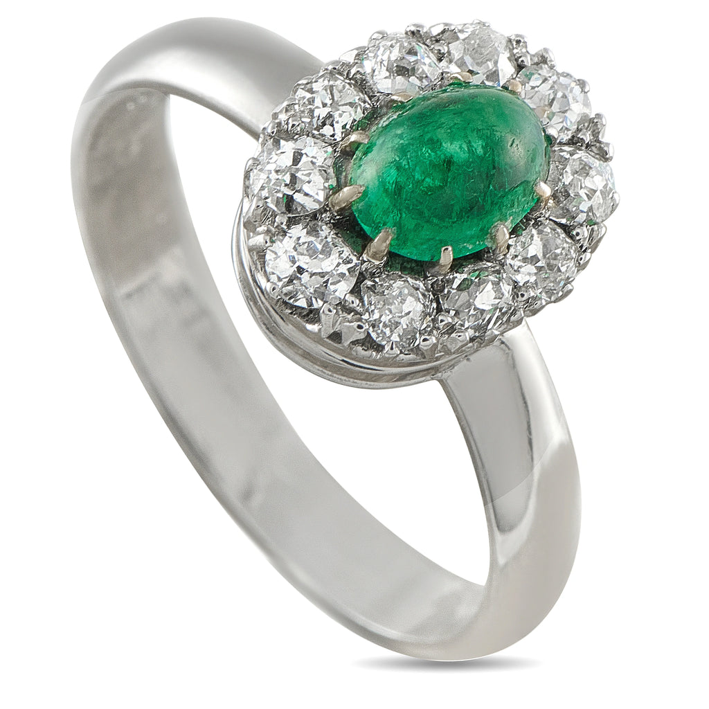 White gold ring with oval green emerald center and diamond halo setting