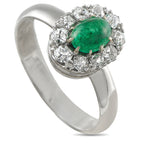 White gold ring with oval green emerald center and diamond halo setting