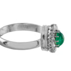 White gold emerald and diamond ring with prong setting, inner hallmark visible