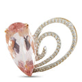 Heart pendant with pink Kunzite center, gold prongs, and diamond halo border