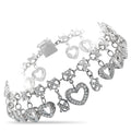 Heart charm bracelet with dangling heart and cross charms, prong-set sparkle