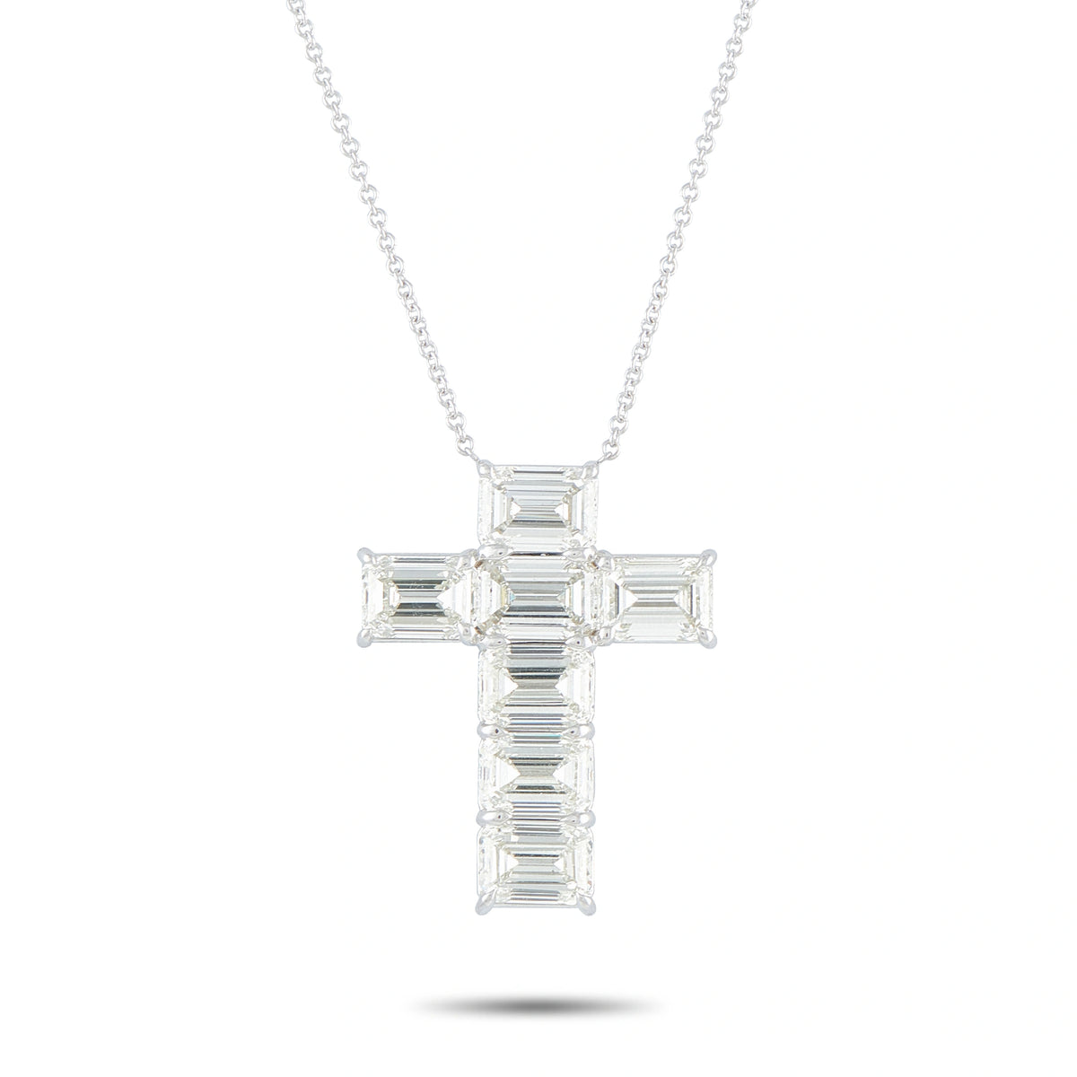 18K white gold diamond cross pendant with baguette-cut stones on a fine chain