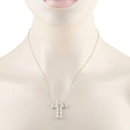Diamond cross pendant necklace shown worn, with baguette-cut stones in white gold