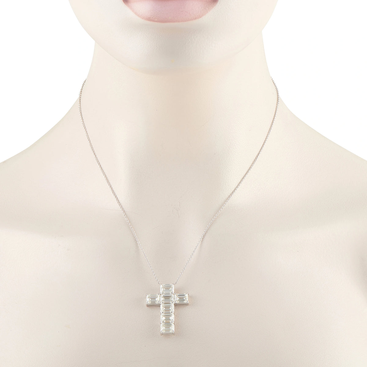 Diamond cross pendant necklace shown worn, with baguette-cut stones in white gold
