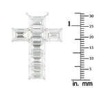 Baguette-cut diamond cross pendant shown beside a millimeter ruler