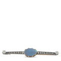 Oval opal blue center brooch with diamond pavé bar and gold frame