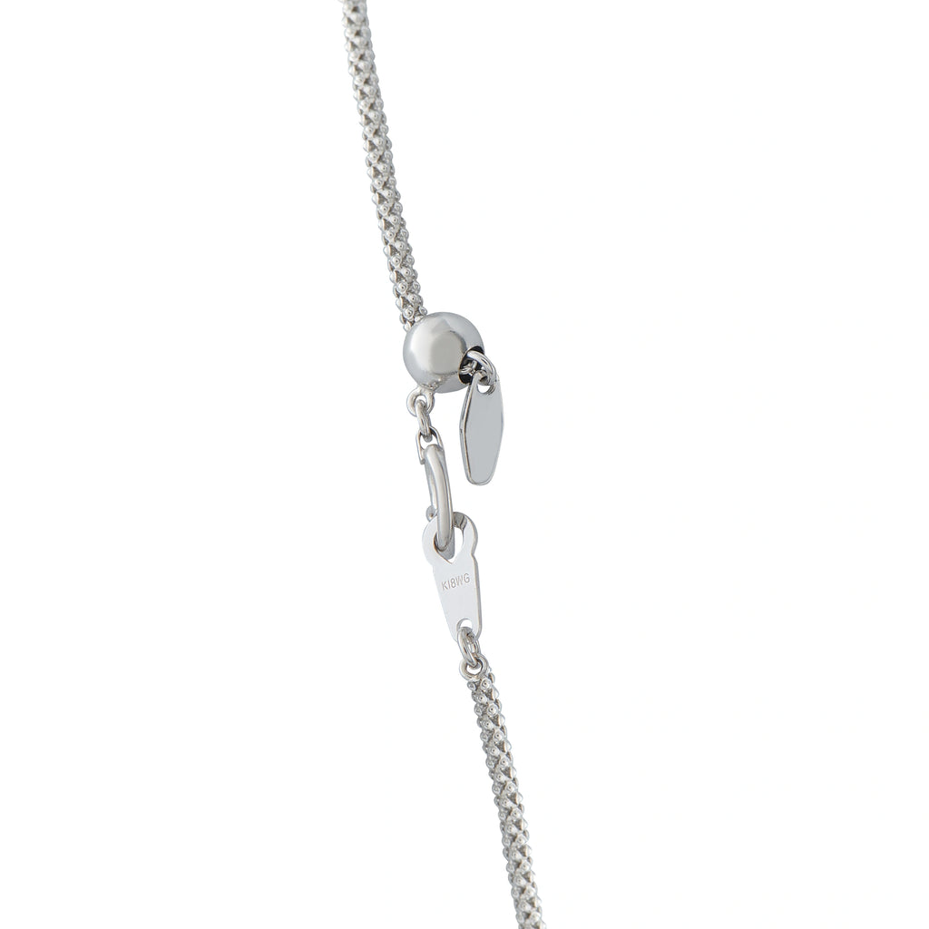 White gold chain necklace with heart-shaped clasp and opal pendant charm