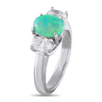 White gold three-stone ring, large oval green opal flanked by two round diamonds