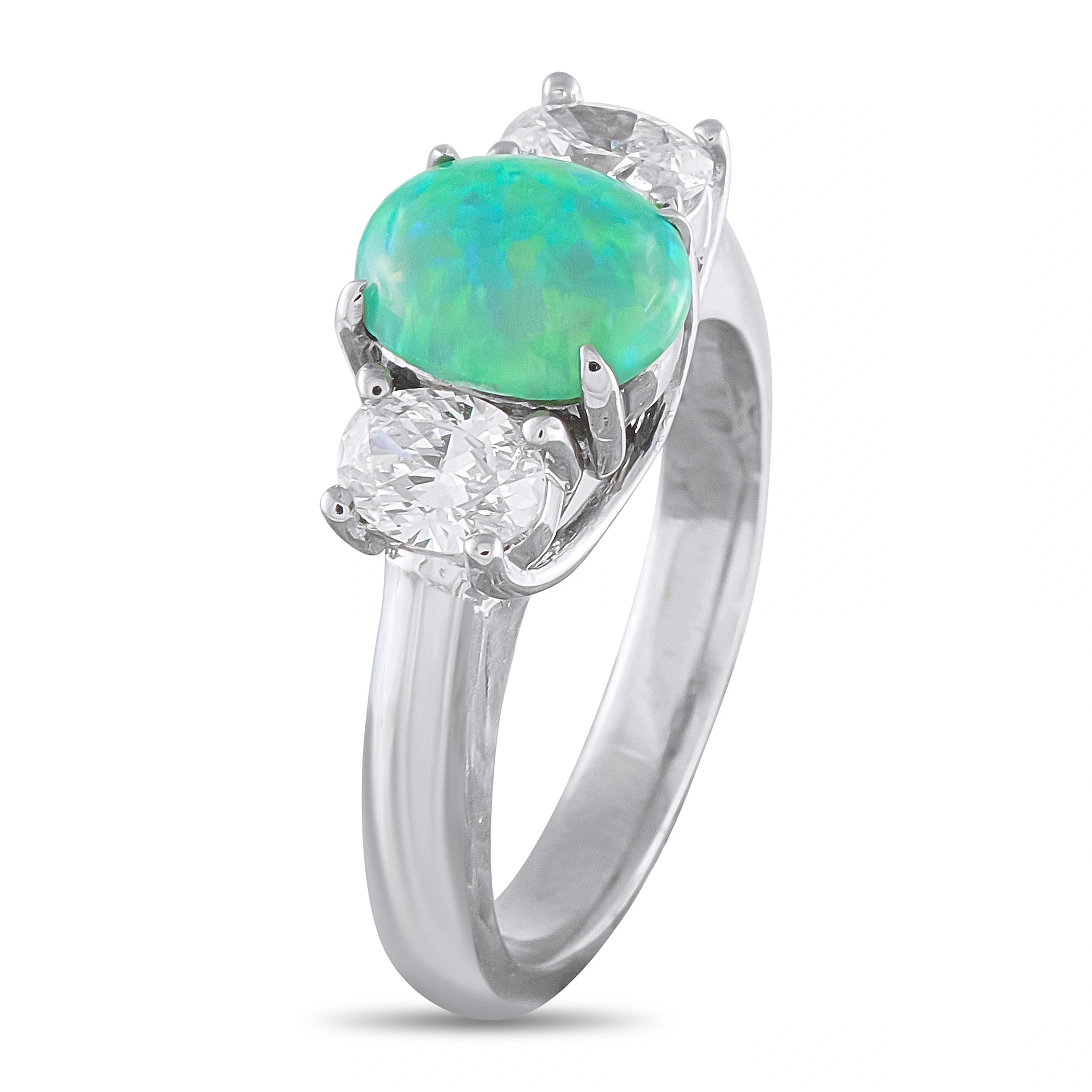 White gold three-stone ring, large oval green opal flanked by two round diamonds