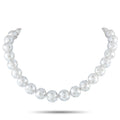 White pearl and diamond bead necklace with round pearl-like spheres