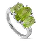 Exclusive 18K White Gold 0.11ct Diamond and Peridot Ring - This exquisitely crafted ring offers a stylish twist on tradition. A 2.49 carat Peridot gemstone makes a statement at the cen