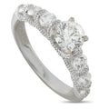 White gold diamond ring with oval center stone and halo of smaller diamonds