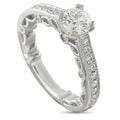White gold diamond engagement ring with milgrain lace setting and large round center stone