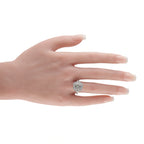 18K white gold diamond halo ring on a hand